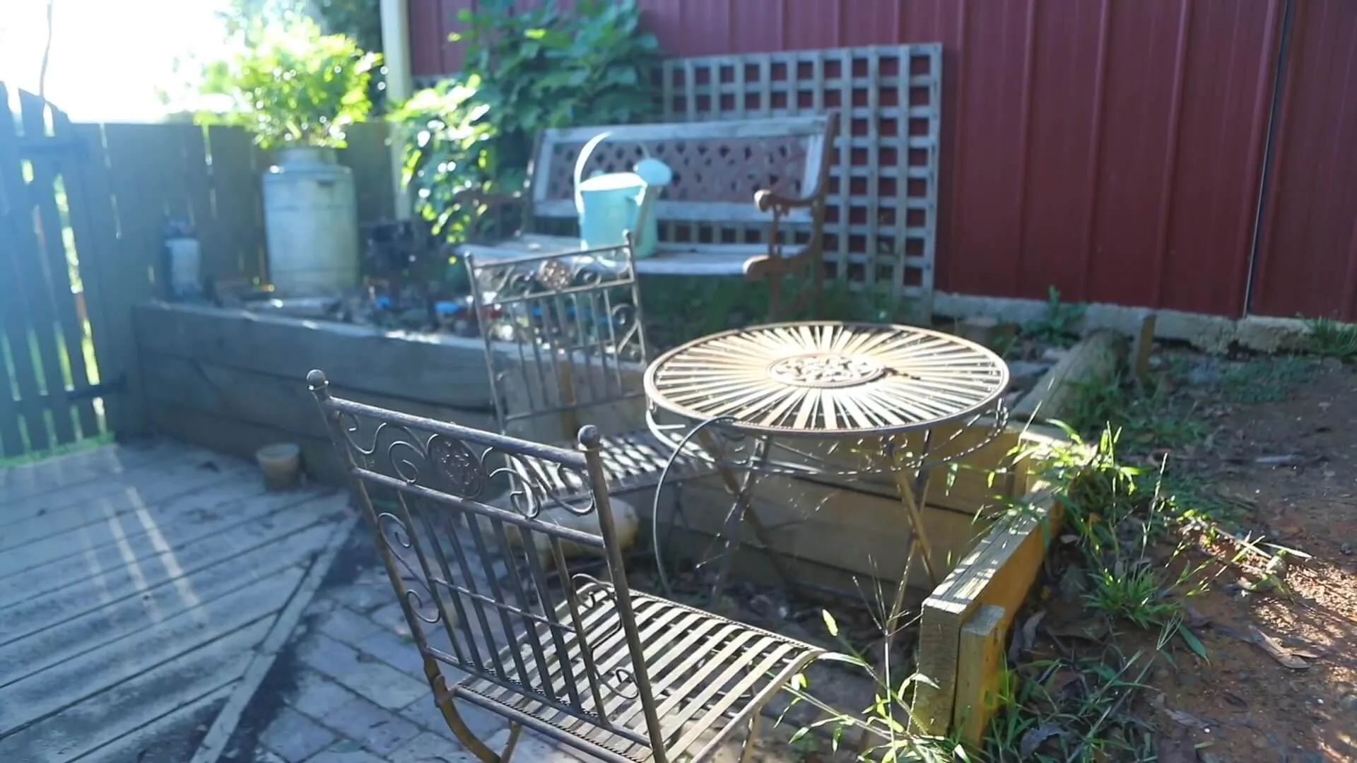 Vintage benches arranged in a side garden.